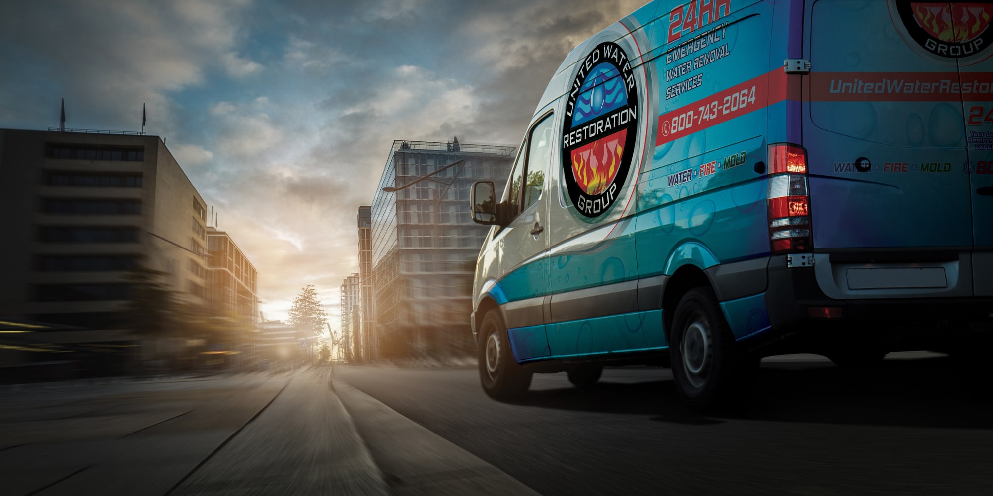 A United Water Restoration Group of East Grand Rapids van heading out on an emergency call at sunset